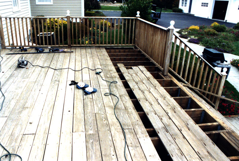 Taking off the old deck to prepare for the Teak Deck