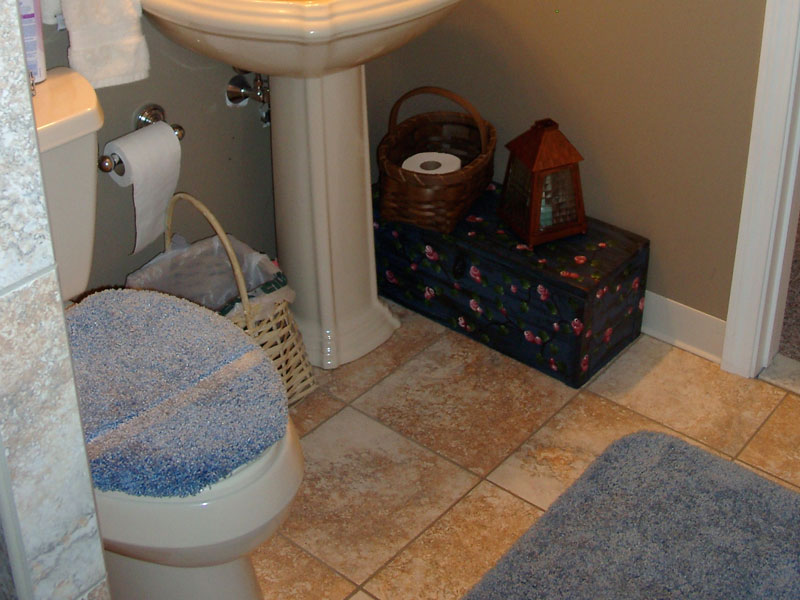Bathroom upgrade, showing pedestal sink and tiled floor. Let Kelley Carpentry make your bathroom new