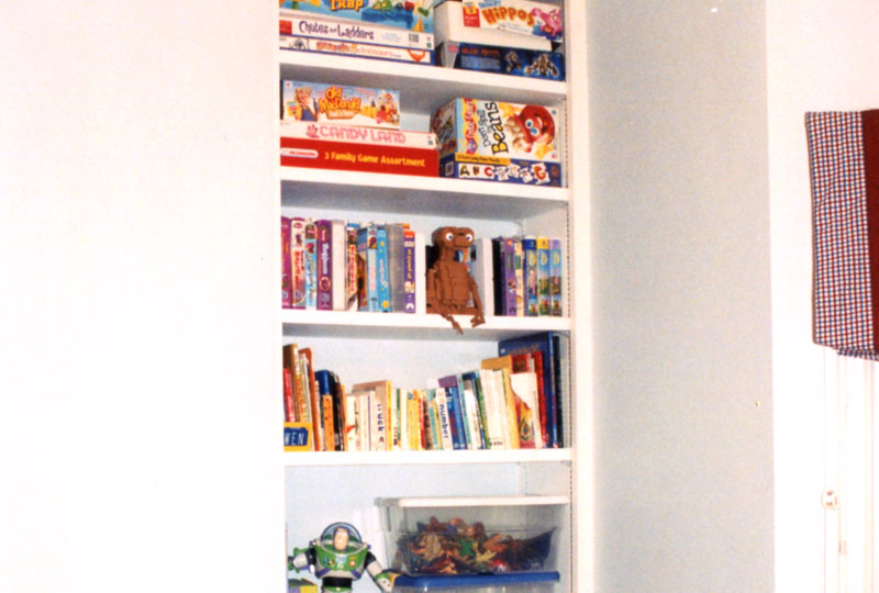 A built-in closet with custom, movable shelving provides perfect storage for the children.