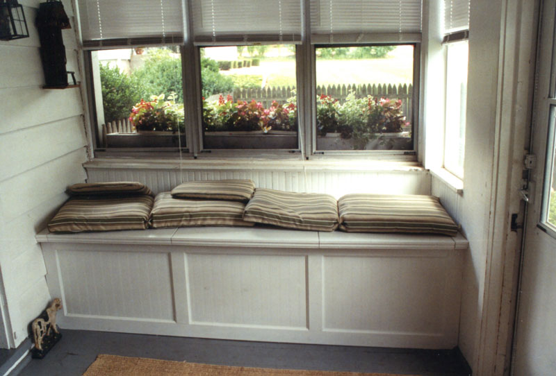 Custom built-in seating and storage in front porch.