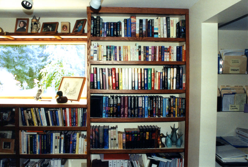 Adding bookshelves to this room solved storage problems and placed books at easy reach.