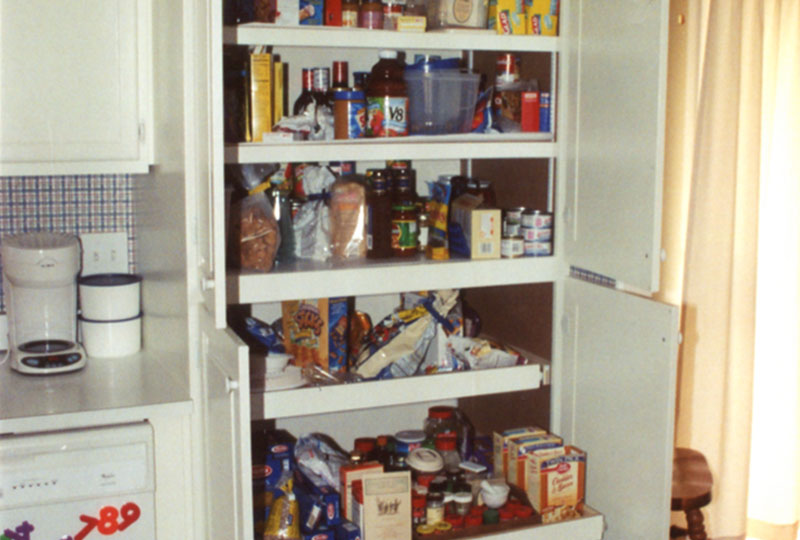 Built-in kitchen pantry, showing convenient pull-out drawers, adding convenience.