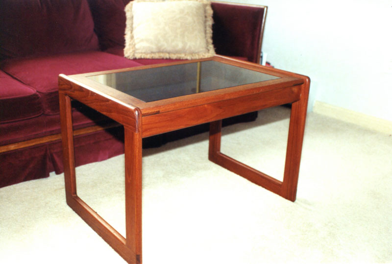This glass-top coffee table perfectly suits, the owner, being at the right height.