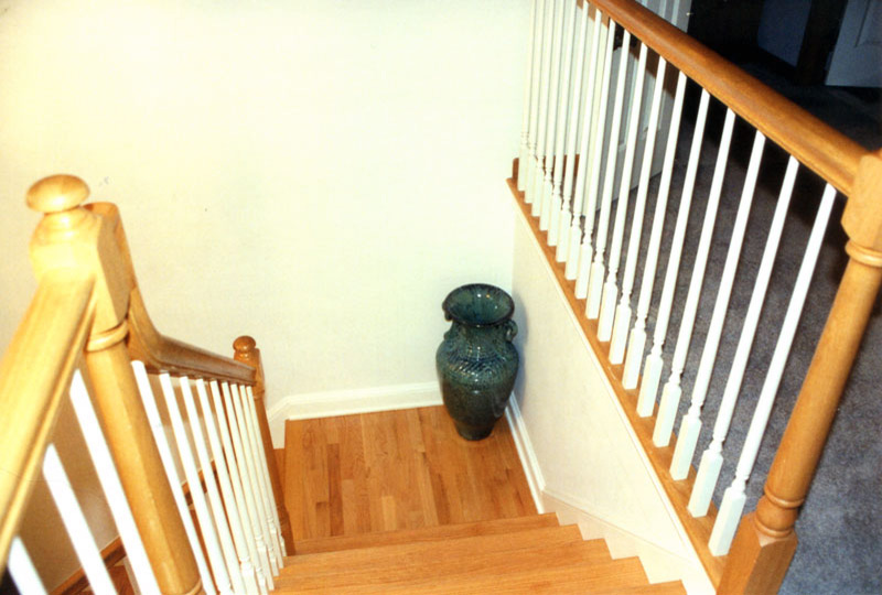 This staircase with blank white walls lacks interest.